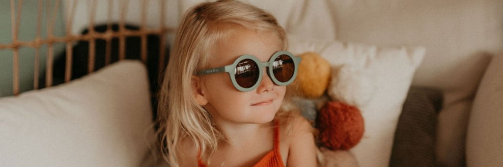 Little girl wearing Grech & Co sunglasses in Fern green