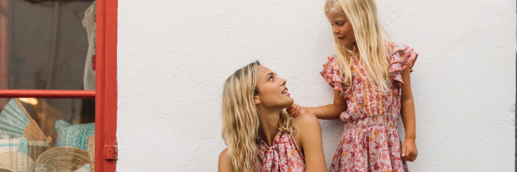 Mummy and daughter wearing matching dresses from French resort wear brand Poupette St Barth