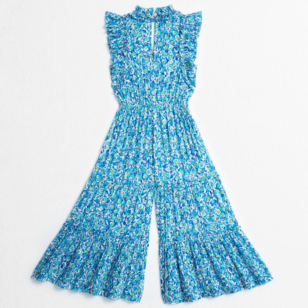 Product shot of the back of the Poupette St Barth long Belene jumpsuit in blue Ocean Flowers print
