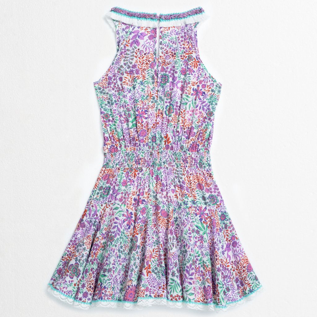 Product shot of the back of the Agathe Mini Dress from Poupette St Barth Kids in White Lavender Nature print 