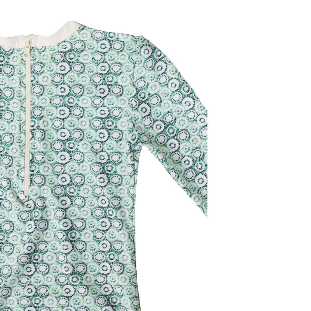 Close up view of the Folpetto Rebecca Surf Suit with long sleeves featuring a gorgeous jellyfish print in mint and sage green
