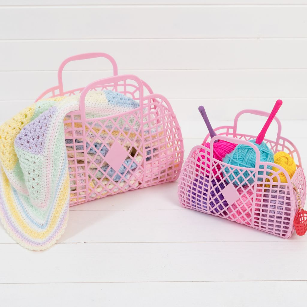 Lifestyle shot of the Sun Jellies Small and Large retro Basket Bags