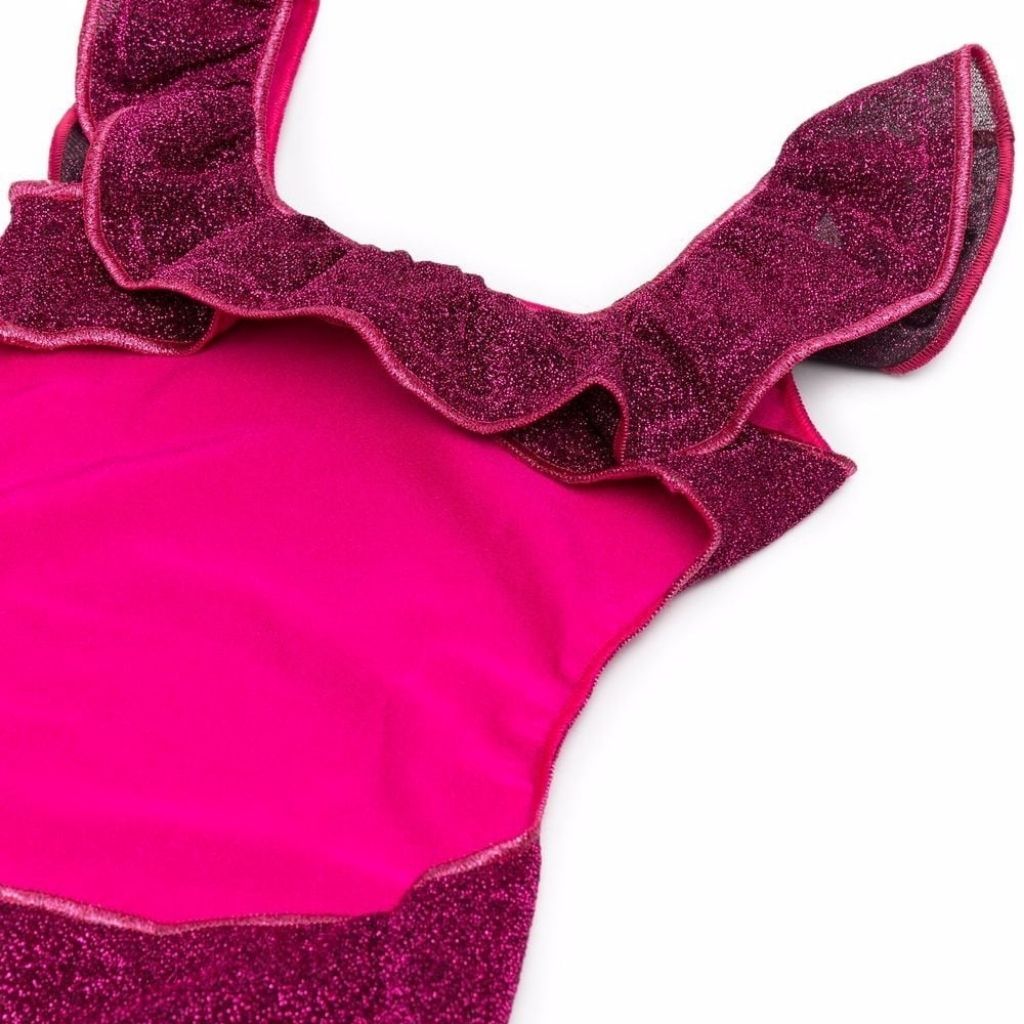 Close up of back detail on Oseree Kids Lumiere Girl Metallic Ruffle Swimsuit with cut out detail in dark fuchsia pink