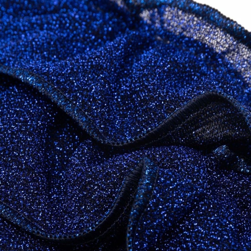 Close up of fabric on Oseree Kids Lumiere ruffle bikini bottoms in metallic blue