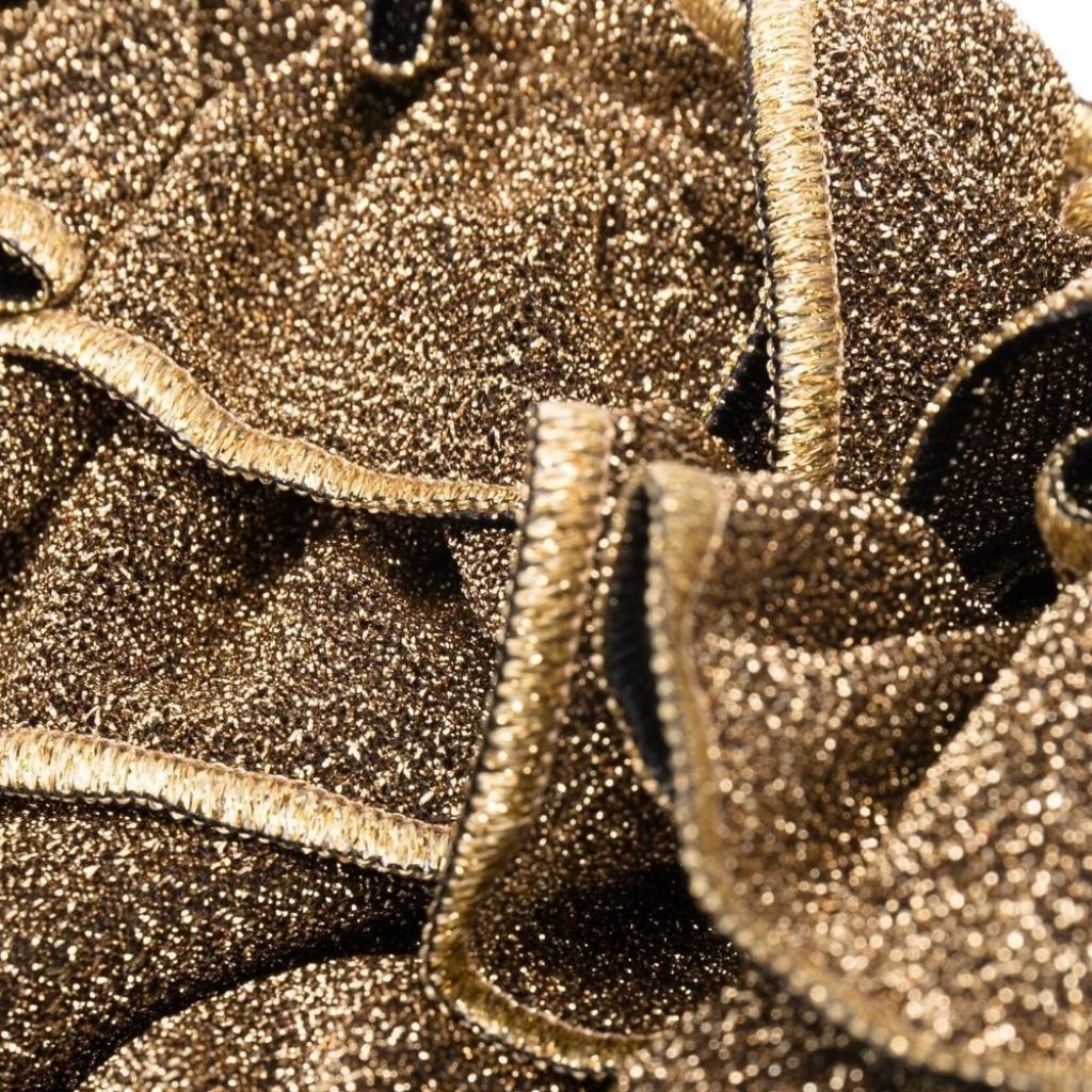 Close up of fabric on Oseree Kids Osemini Lumiere girls metallic ruffle bikini in gold sand