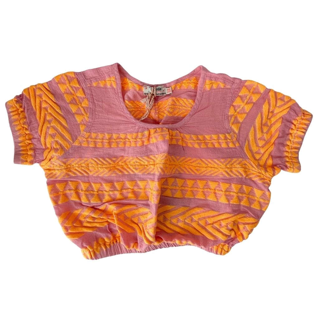 Front of the Aurora Blouse Top in Neon Orange and Neon Pink from the children's line of Greek brand, Devotion Twins