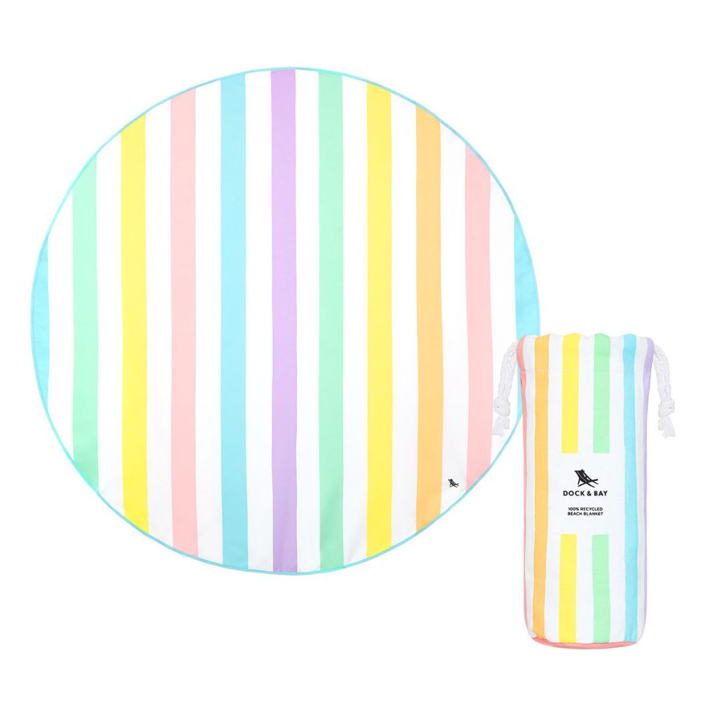 Product shot of Dock and Bay cabana round beach towel and pouch in Unicorn Waves