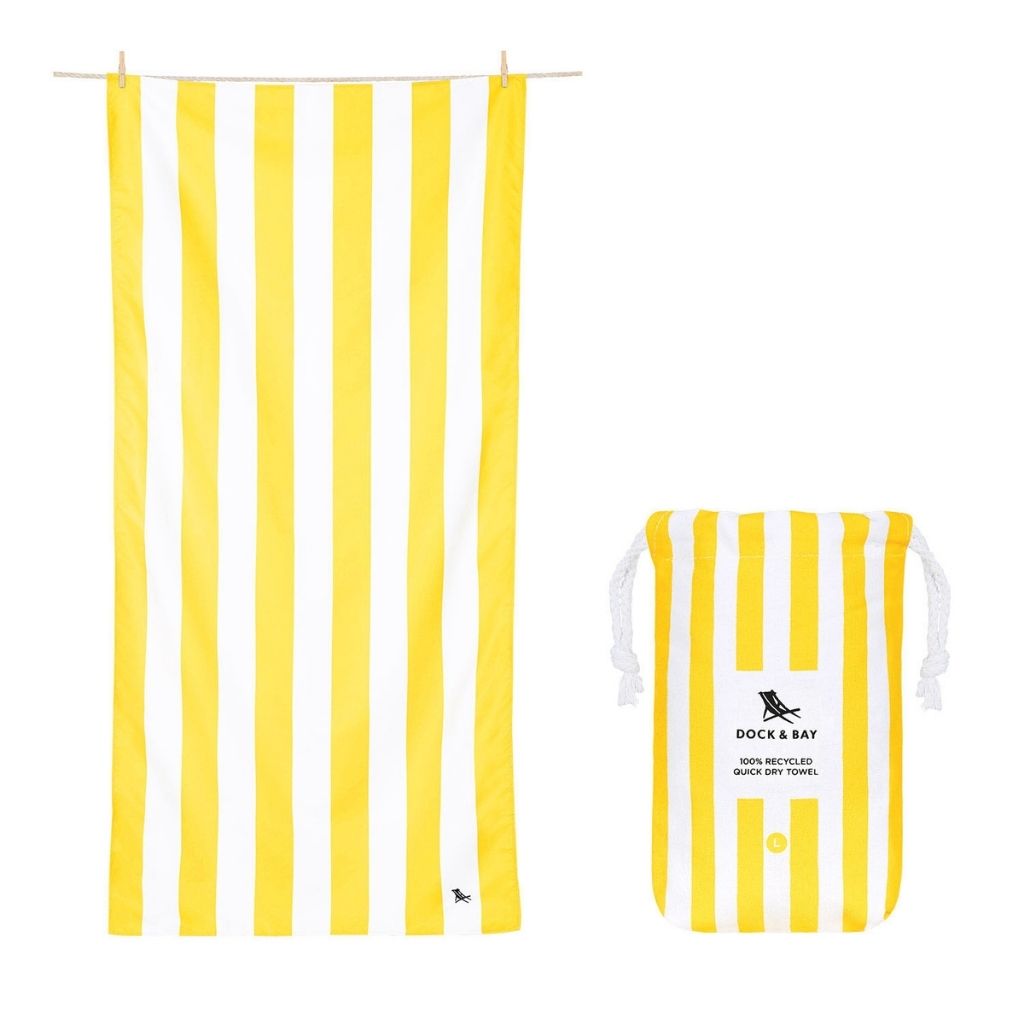 Product shot of Dock and Bay Signature striped cabana towel and pouch in Boracay Yellow