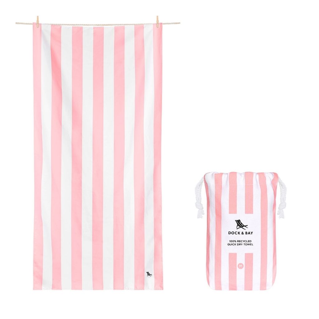 Product shot of Dock and Bay Signature striped cabana towel and pouch in Malibu Pink