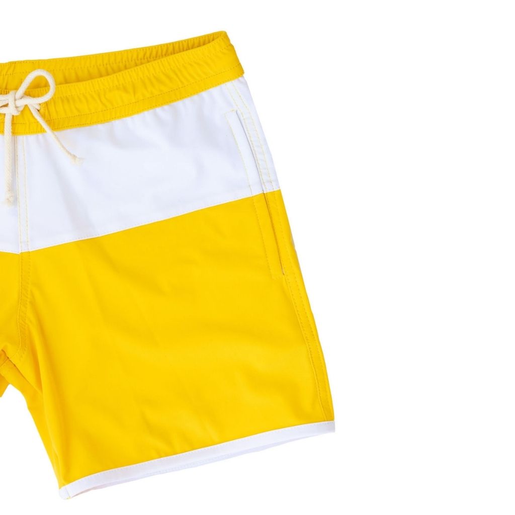 Close up of the pattern and pockets on the Folpetto Jack swim shorts in Sicilian yellow and ivory