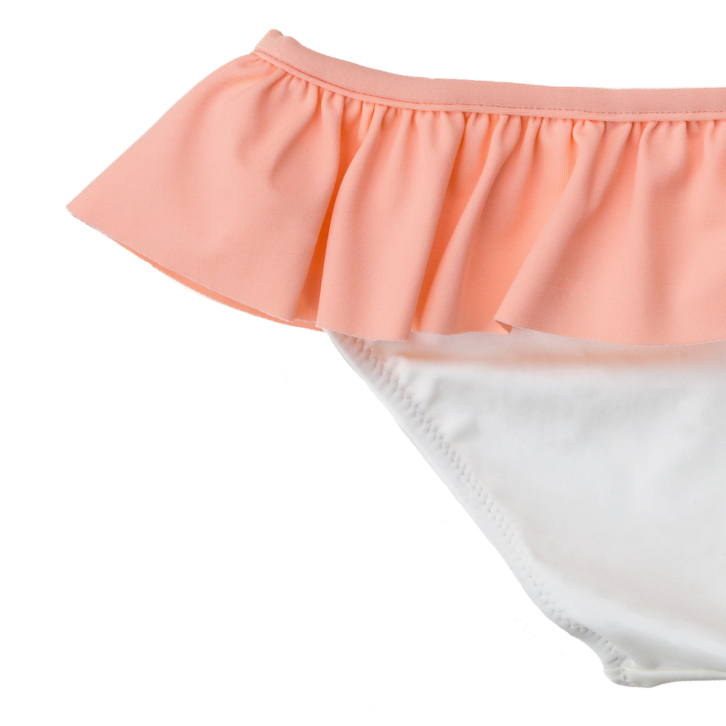 Close up of Folpetto alice swim pants for girls in peach pink