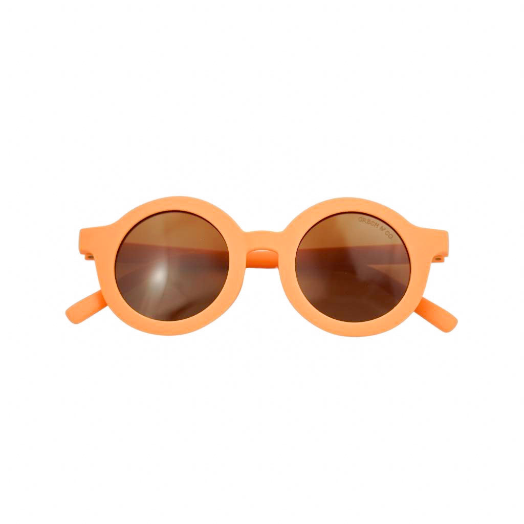 Product shot of Grech and Co sustainable round sunglasses in Melon 