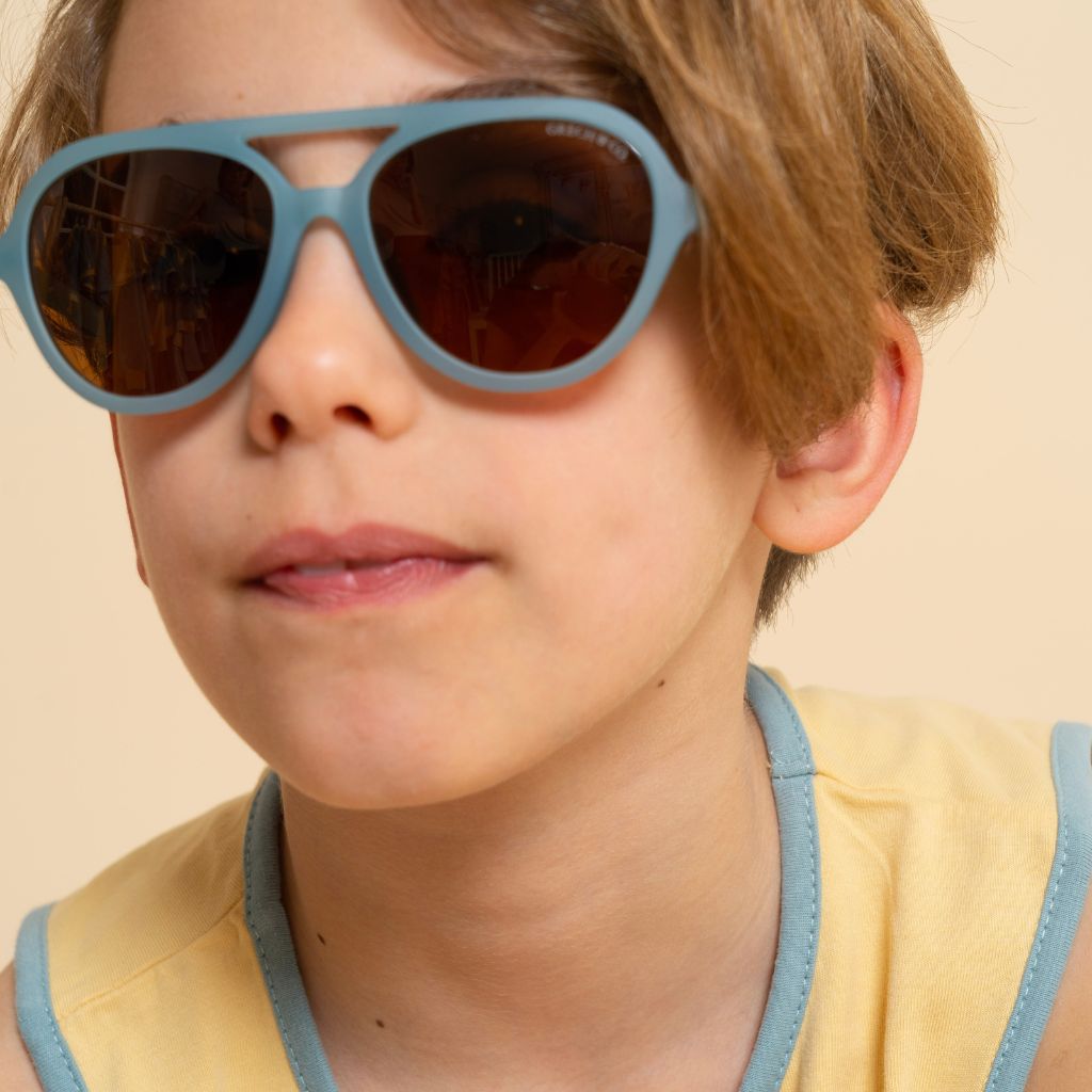 Boy wearing Grech and Co Aviator Polarised Sunglasses for babies, toddlers and children in sky blue