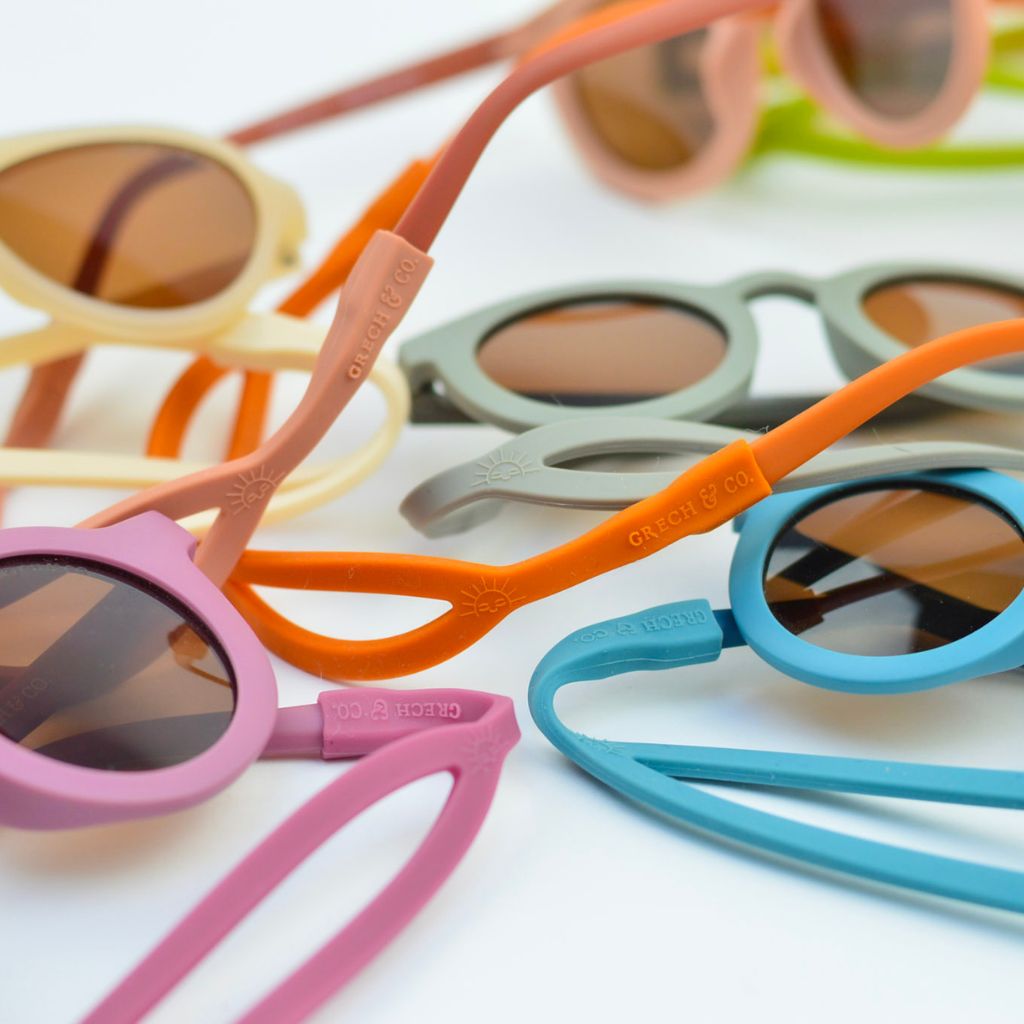 Product shot of Grech & Co baby sunglasses strap in lots of shades