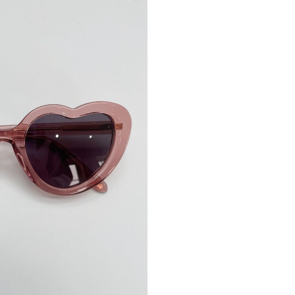 Close up of Maison Juli Margot Candy Pink heart-shaped sunglasses