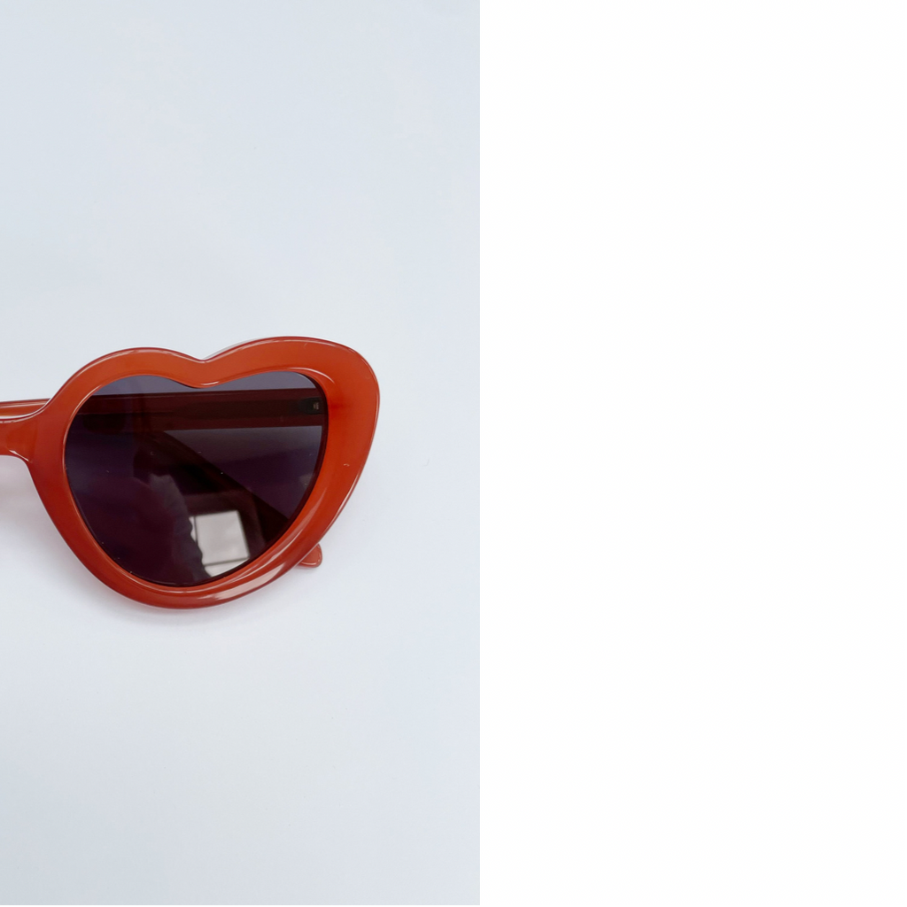 Close up of Maison Juli girl's Margot orange heart sunglasses