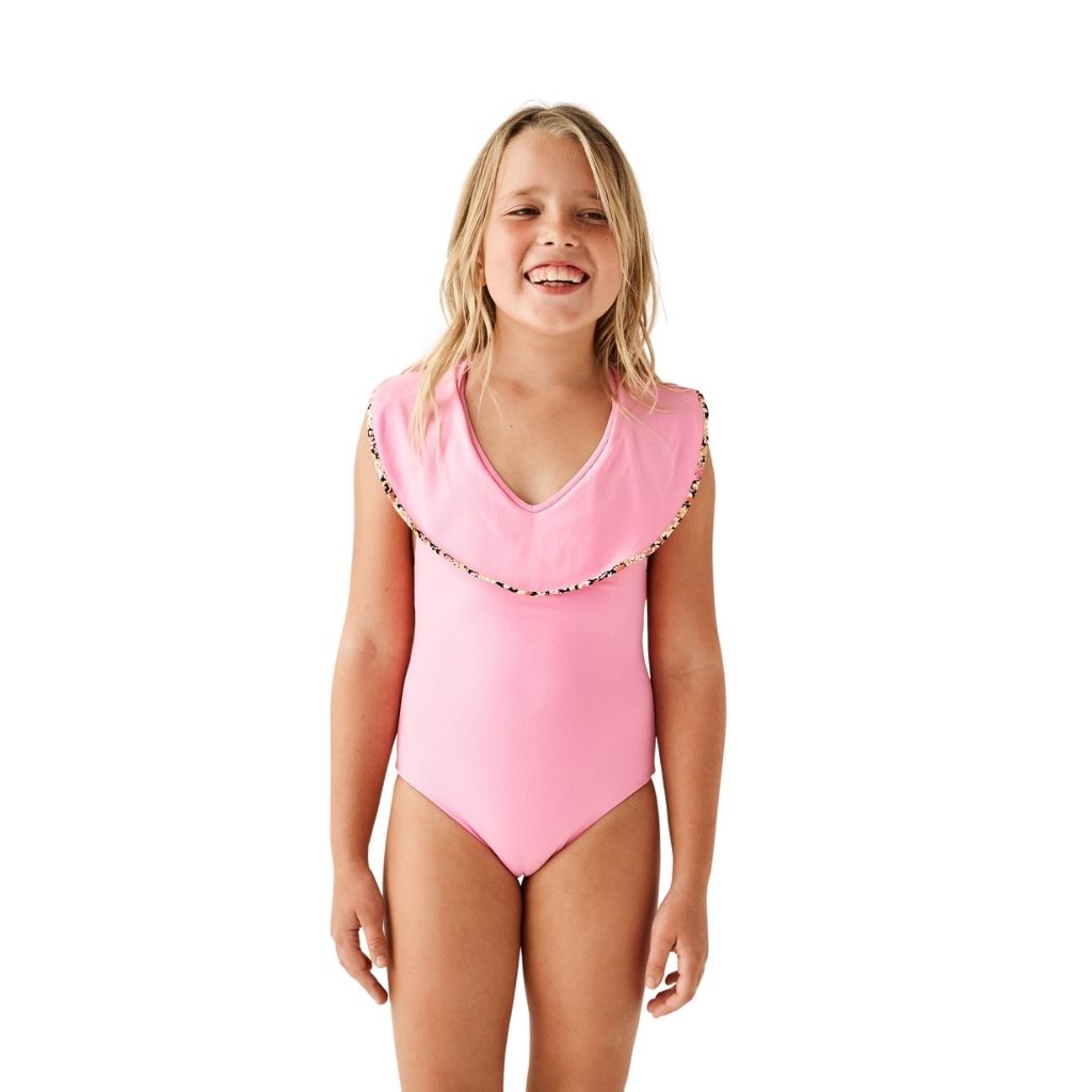 Little girl wearing Marysia Bumby Piana Ruffle Swimsuit in Blossom Pink