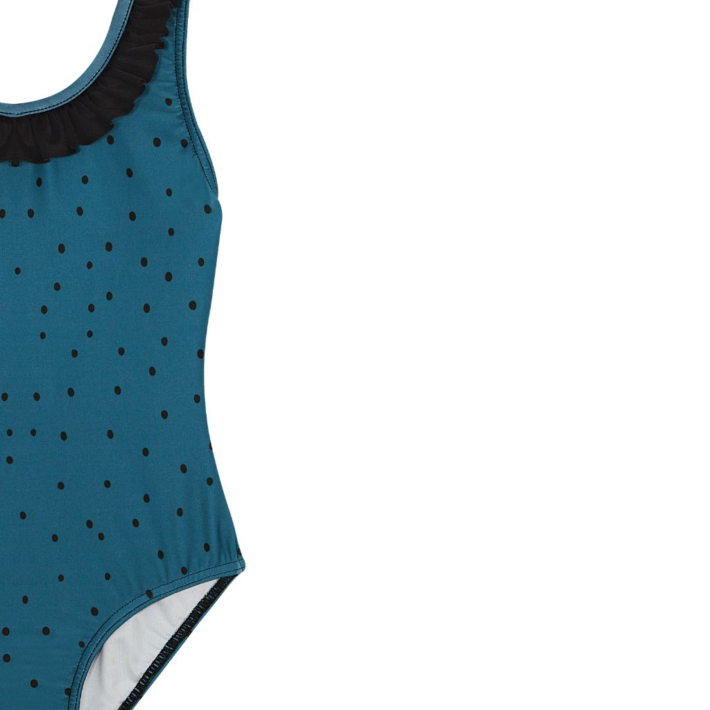 Close up of the pattern on the Suncracy Teal Dots Santorini Eight Swimsuit for girls