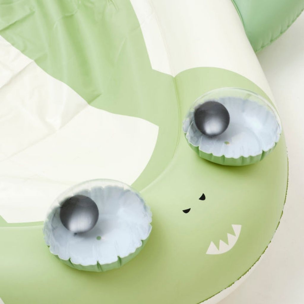 Close up of the googly eyes on the Sunnylife Slip and Slide outdoor garden game in Shark Tribe Khaki