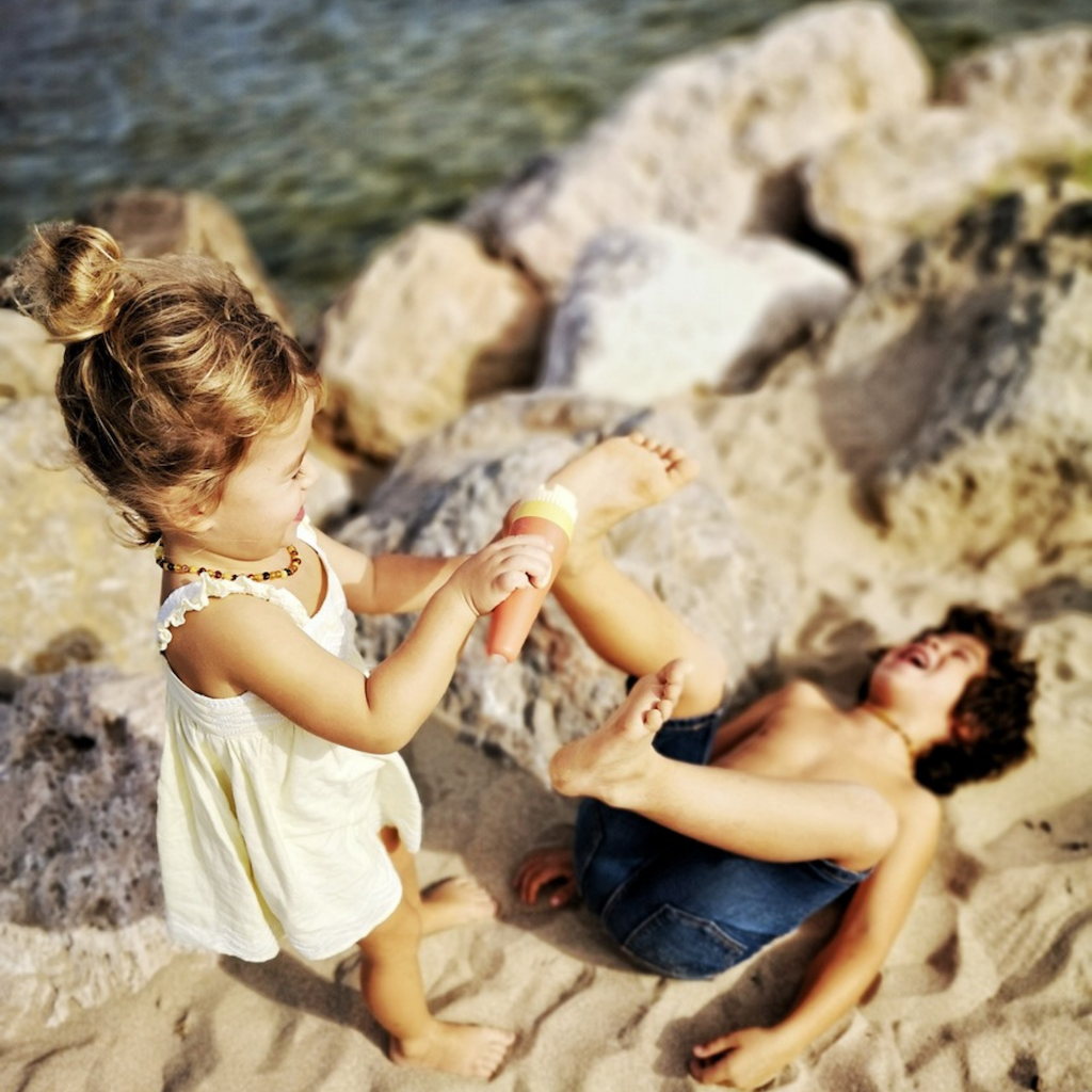 Boy and Girl using SavviSand on the beach