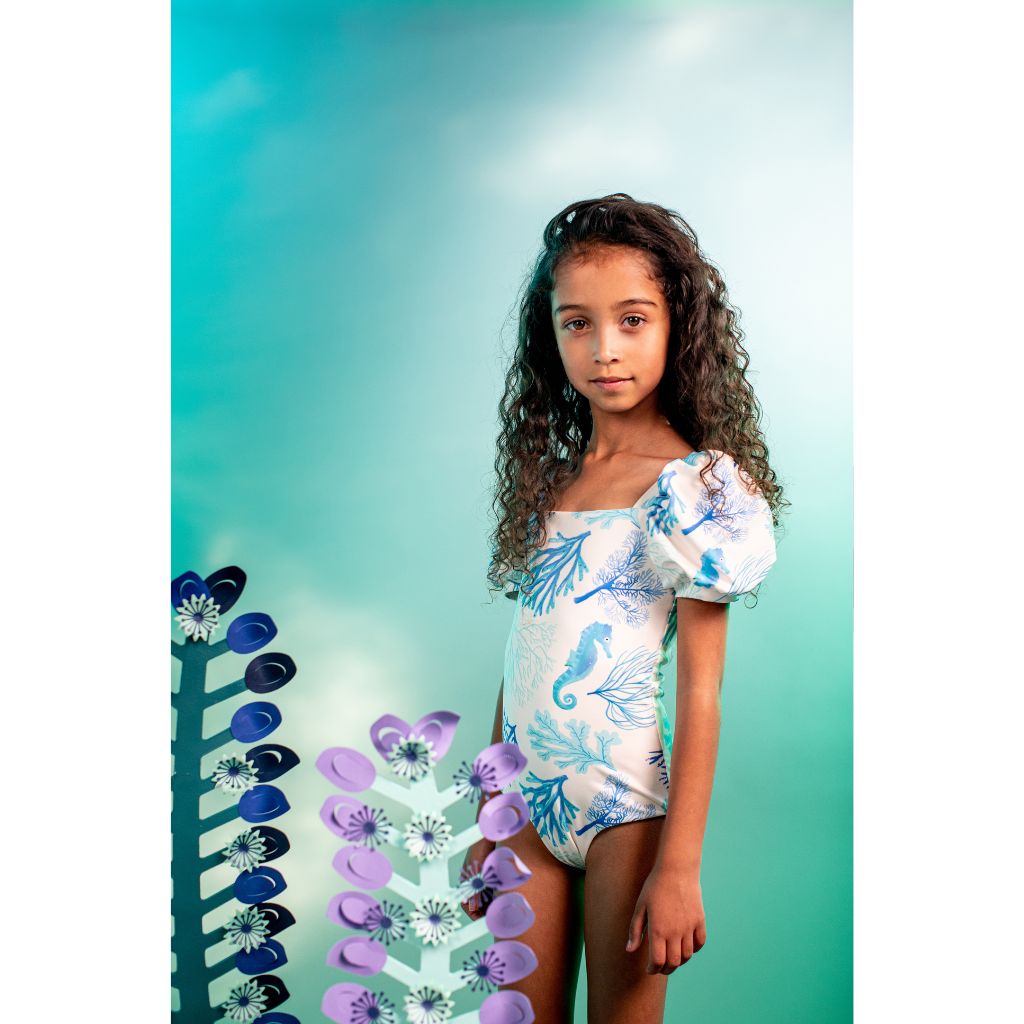 Little girl wearing the Pepita & Me Corales San Andrew Bubble One Piece Swimsuit from the Tornasol Collection