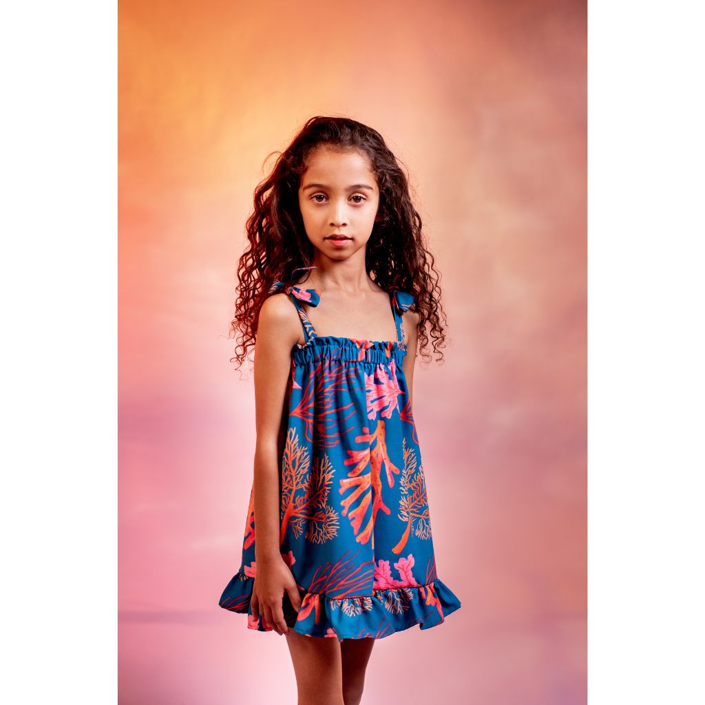 Little girl wearing the Pepita & Me Corales Mar Elisa Dress from the Tornasol Collection