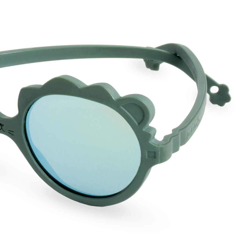 Close up shot of the side of the Ki et La Lion Baby Sunglasses in green