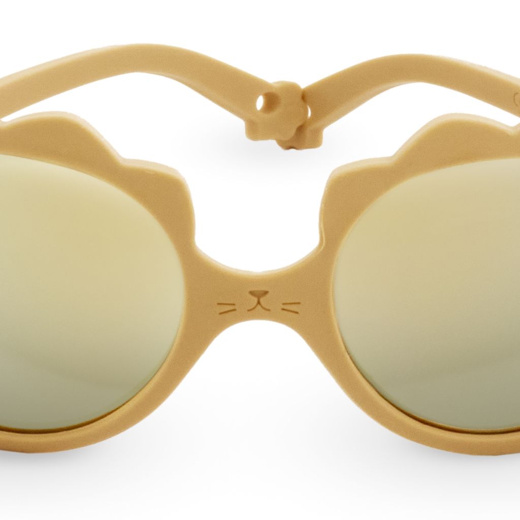 Close up shot of the Ki et La Lion Baby Sunglasses in honey