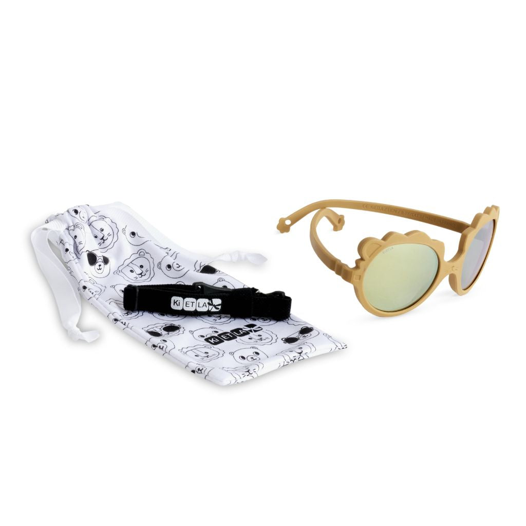 Product shot of the dust bag and strap of the Ki et La Lion Baby Sunglasses in honey