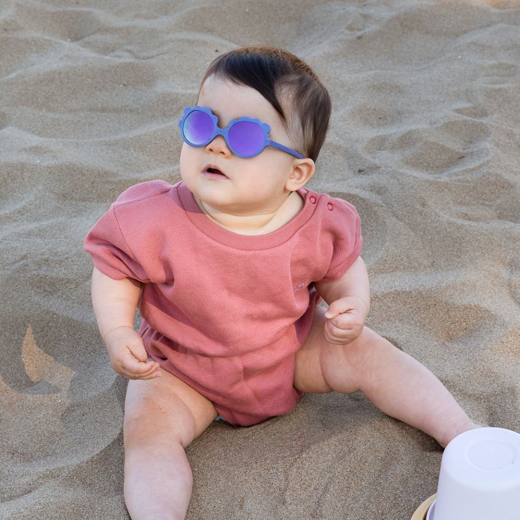 Little girl wearing her Ki et La Baby Lion Sunglasses in Lilac