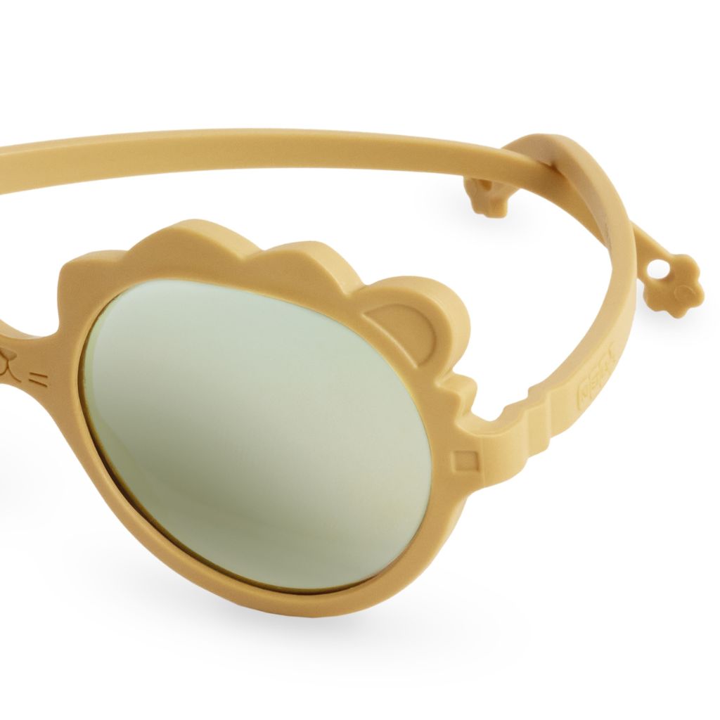 Close up of the side of the Ki et La Lion Sunglasses in honey