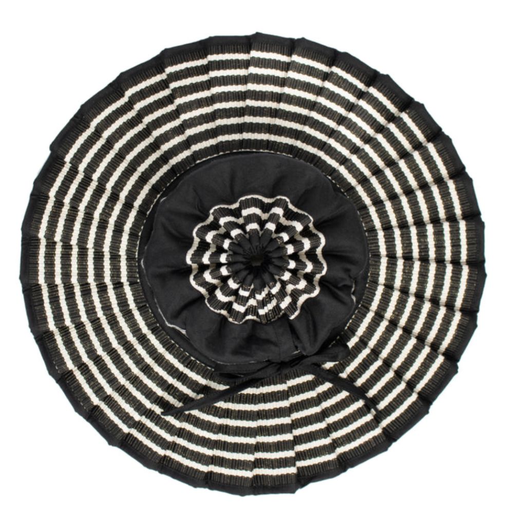 Product shot of a Birdseye view of the the Malta Island Capri Child's Sun Hat from Lorna Murray in black and white