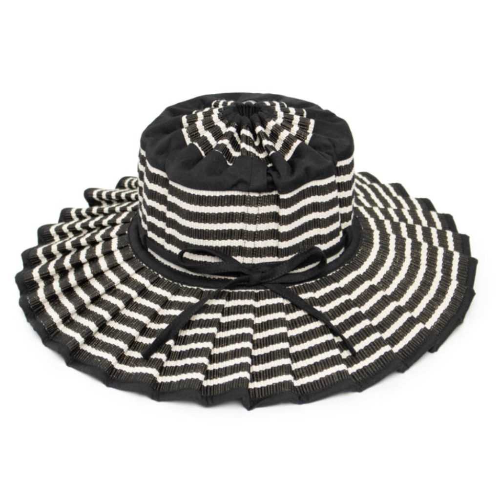 Product shot of a tilted side view of the Malta Island Capri Child's Sun Hat from Lorna Murray in black and white