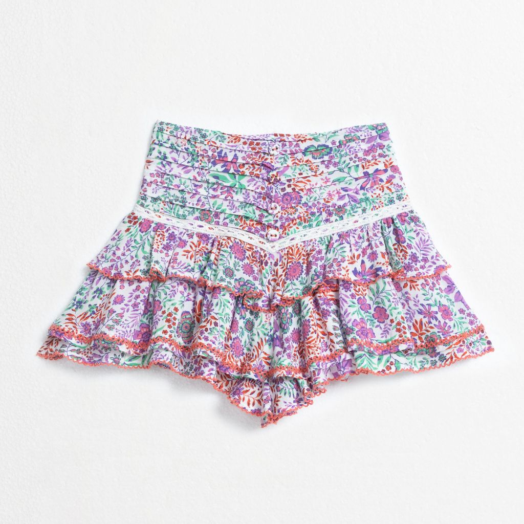 Product shot of the front of the Alizee Mini Skirt from Poupette St Barth Kids in White Lavender Nature print