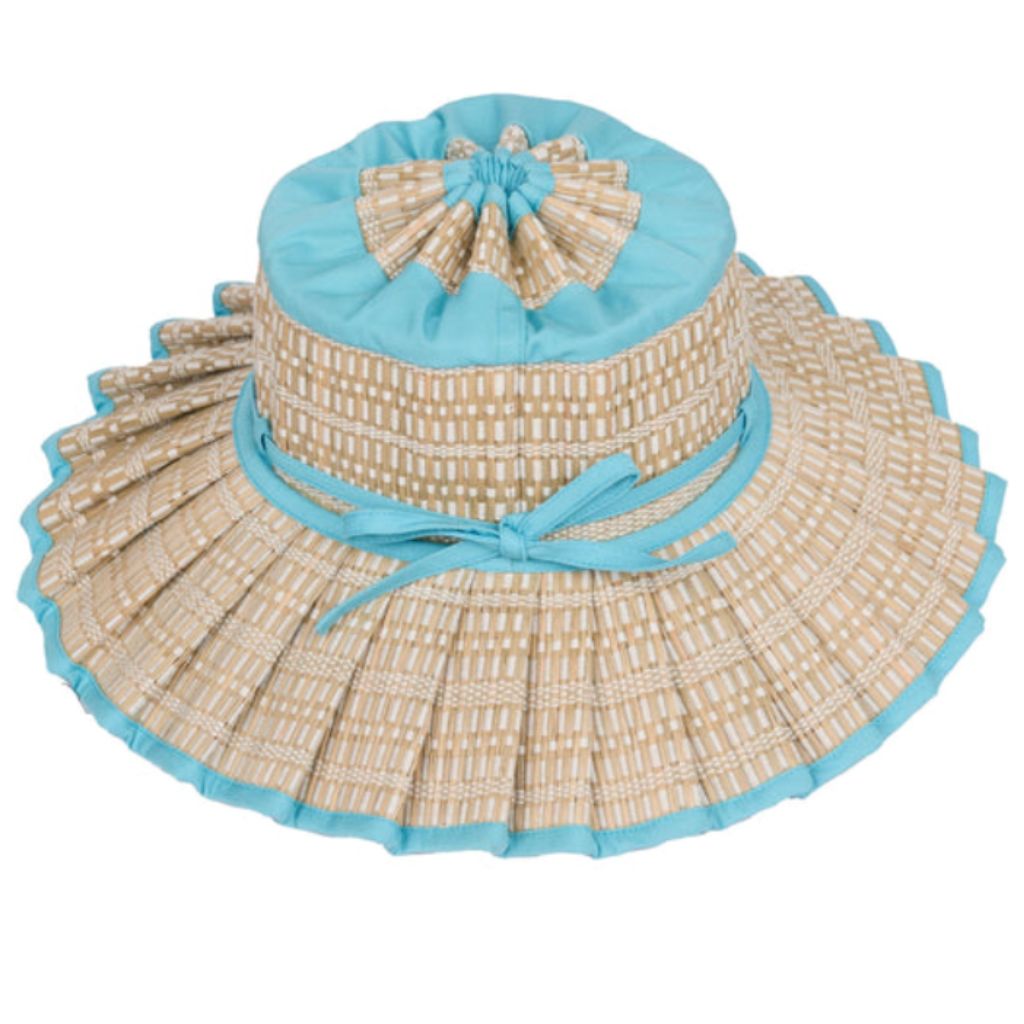Product shot of a tilted side view of the Narrabeen Island Capri Child's Sun Hat from Lorna Murray featuring sky blue trimming