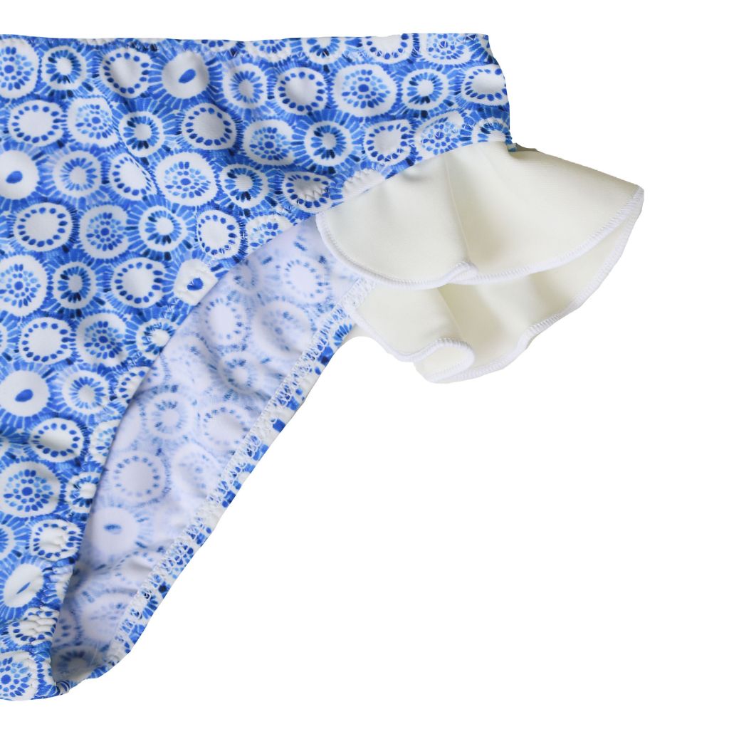 Close up of the Folpetto baby and toddler girl Nora swim pants in dusty blue jellyfish print