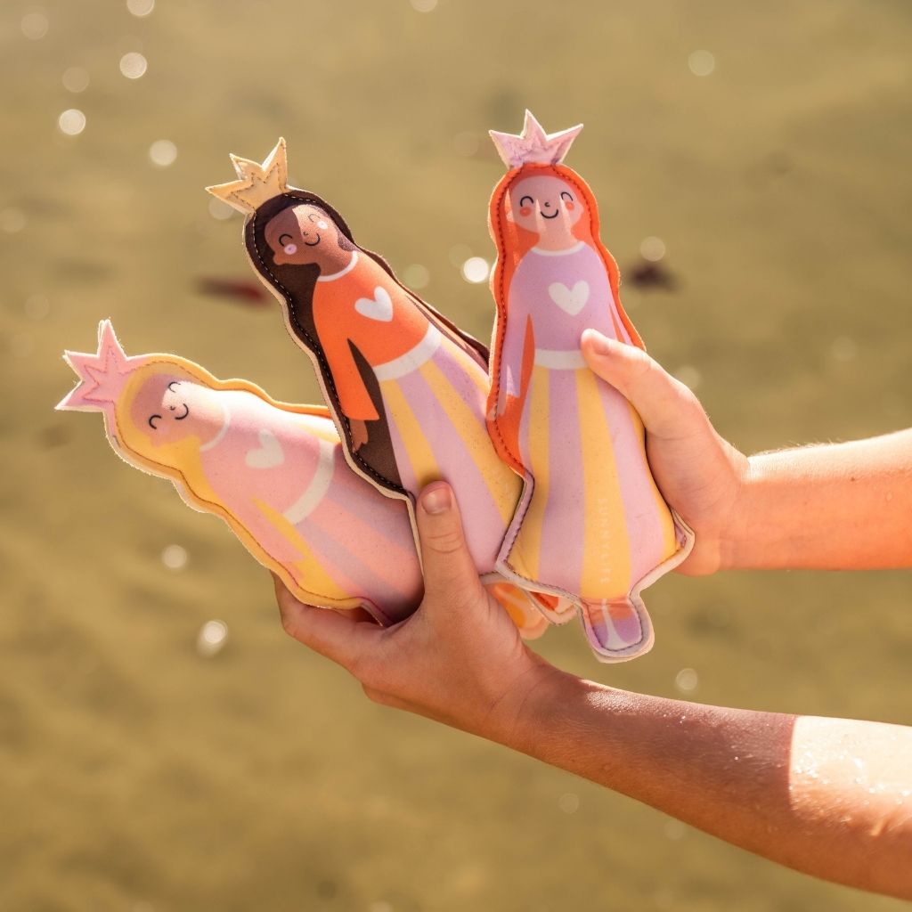 Close up of hands holding the Sunnylife Princess Swan Dive Buddies