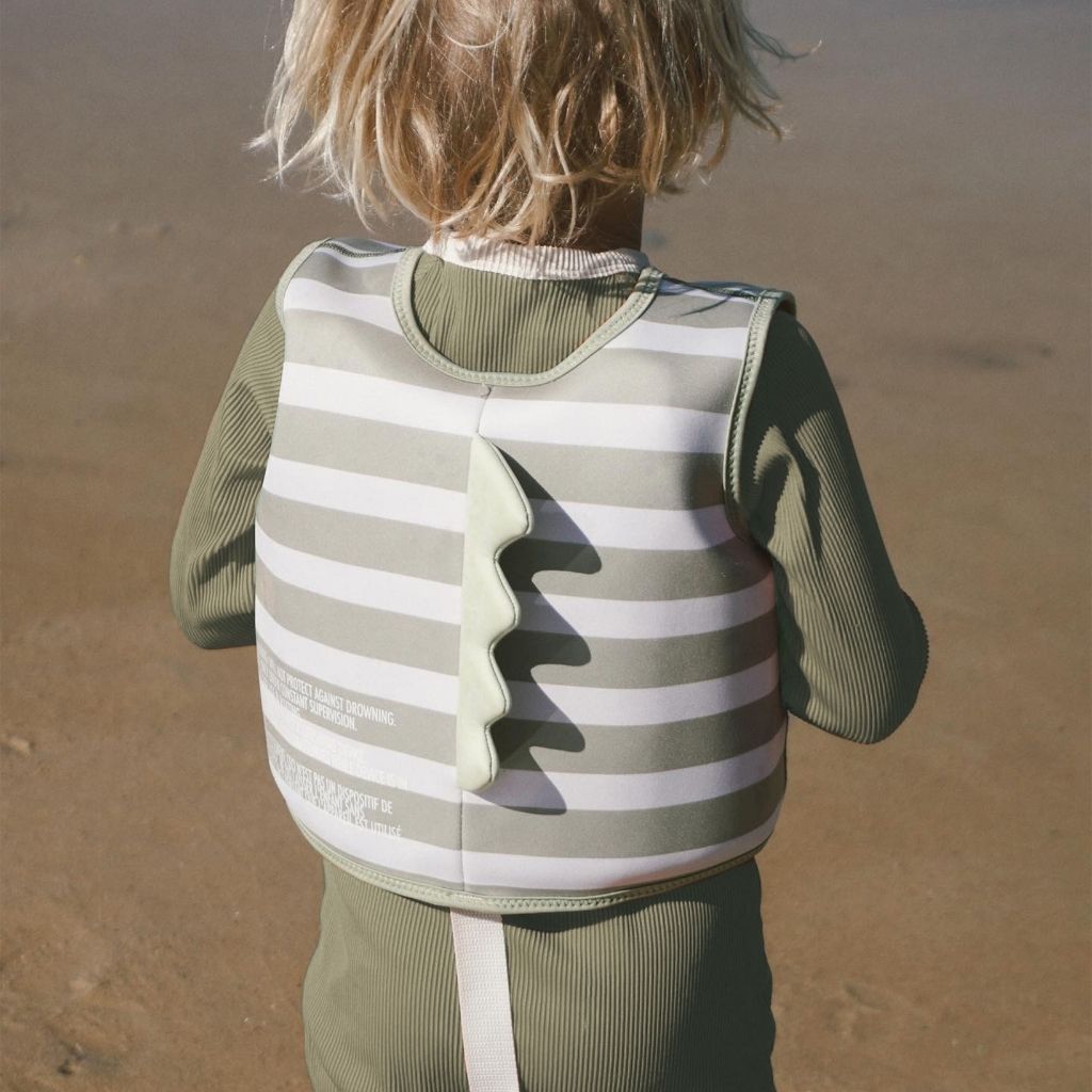 Little boy from behind wearing the Sunnylife Into The Wild Swim Vest