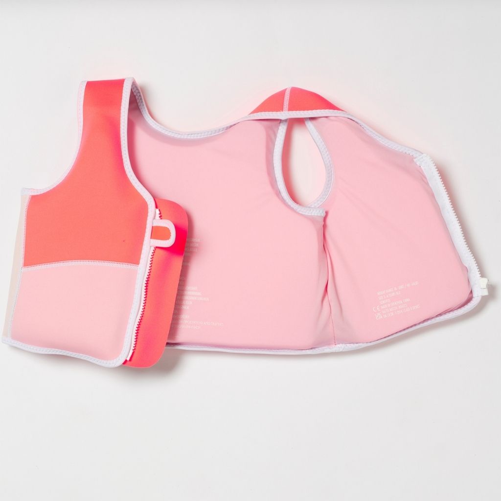 Product shot of the inside of the Sunnylife Kids Melody the Mermaid swim vest in neon strawberry