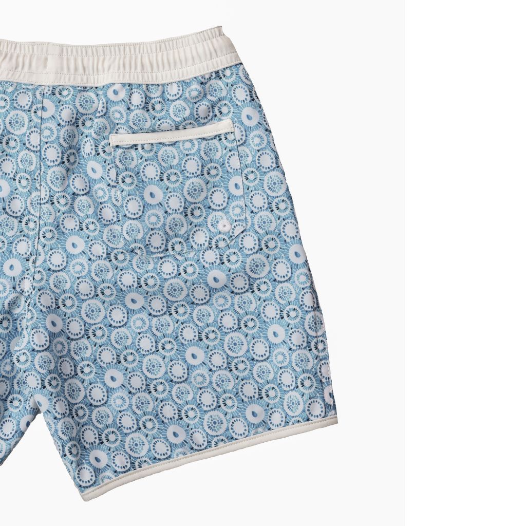 Product shot of the details on the Folpetto Tommaso swim shorts in dusty blue jellyfish print