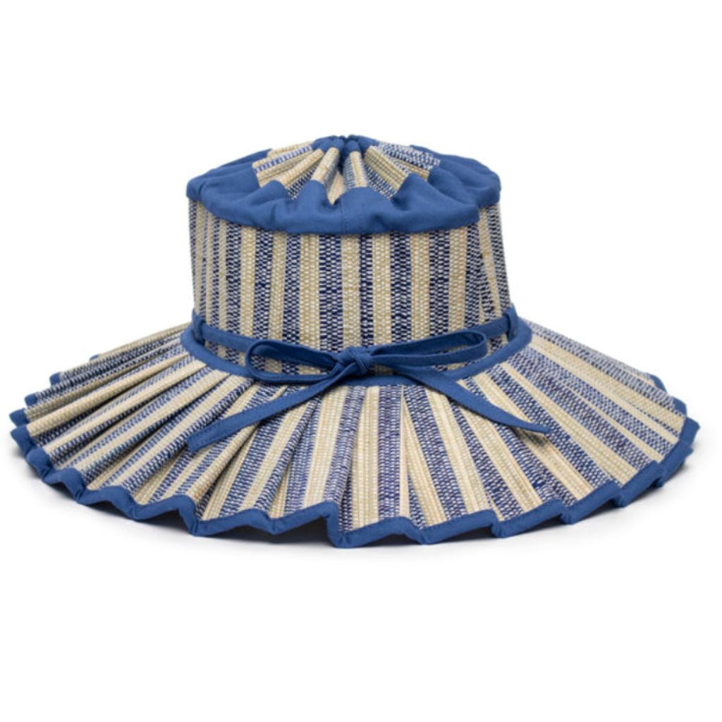 Product shot of a side view of the Valletta Island Capri Child's Sun Hat from Lorna Murray in Royal Blue