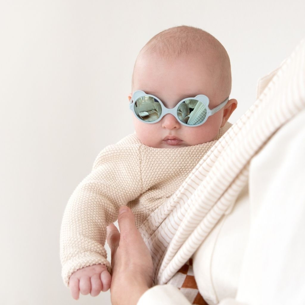Baby wearing Ki et La Ours'on baby sunglasses in in sky blue