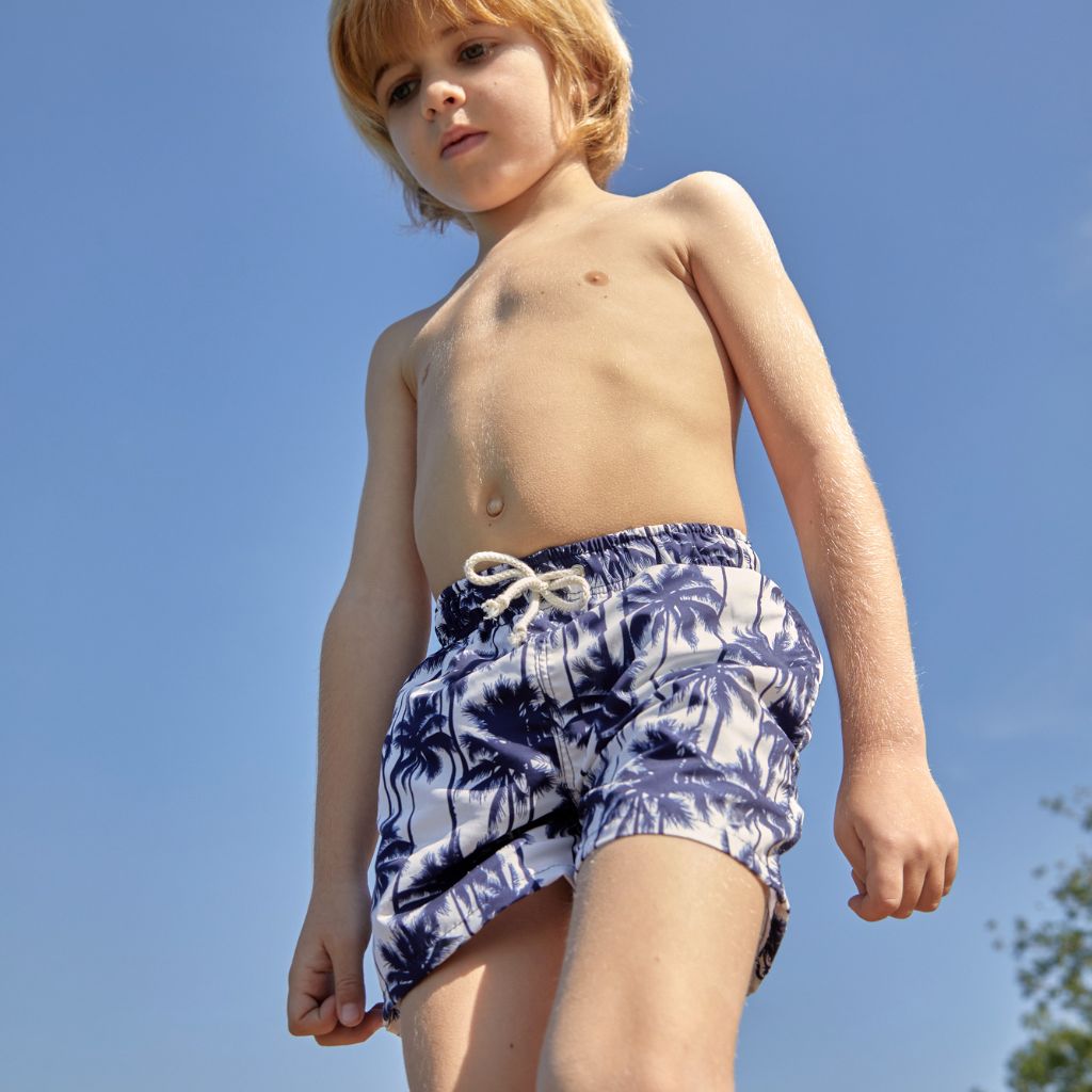 Boy wearing Suncracy Palms Menorca Tactel Swim Shorts for Boys