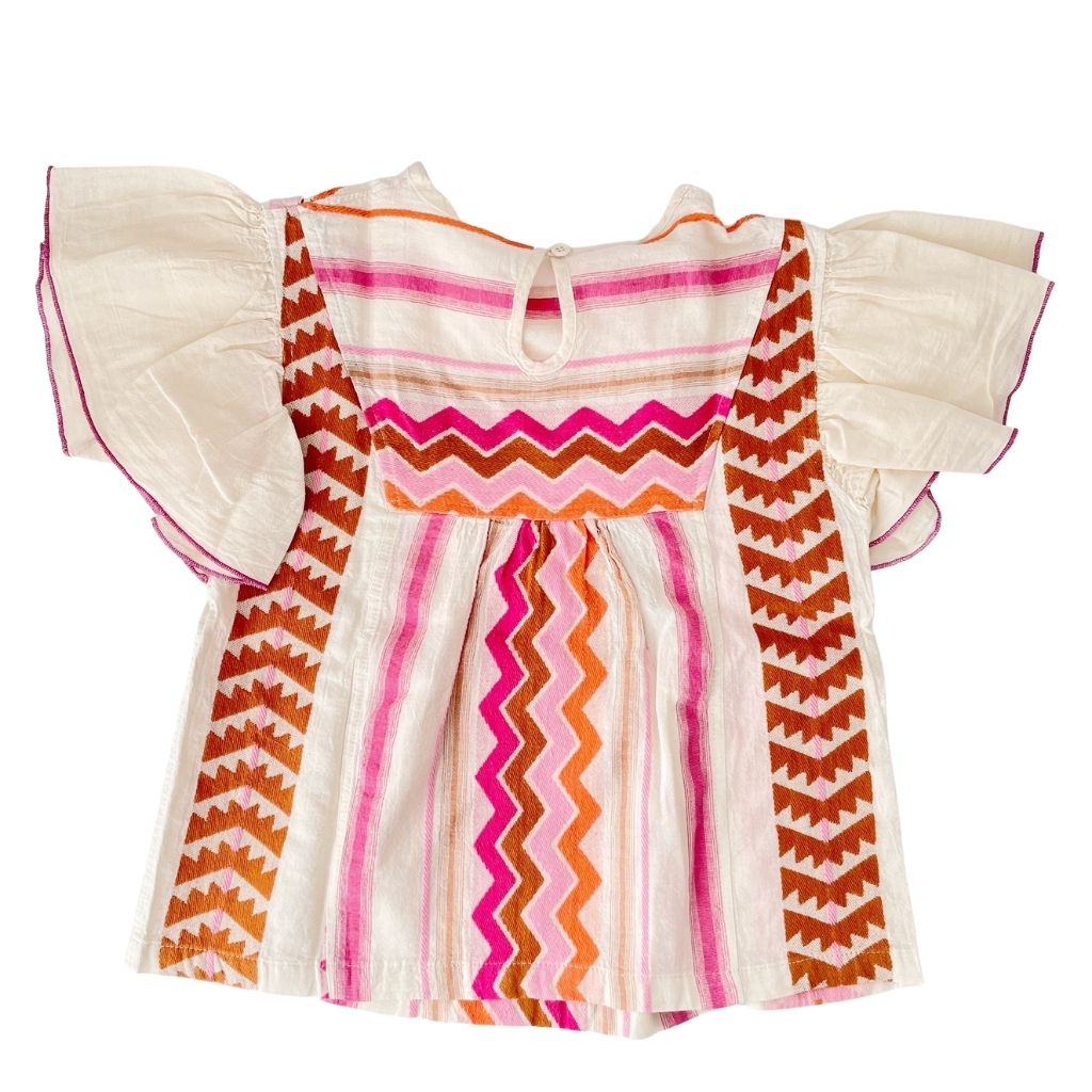 Back of the Devotion Twin Stars children's Adela blouse top in shades pink, orange and brown
