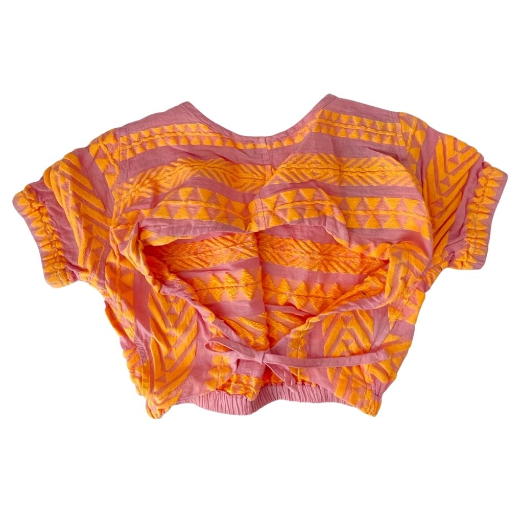 Back of the Aurora Blouse Top in Neon Orange and Neon Pink from the children's line of Greek brand, Devotion Twins