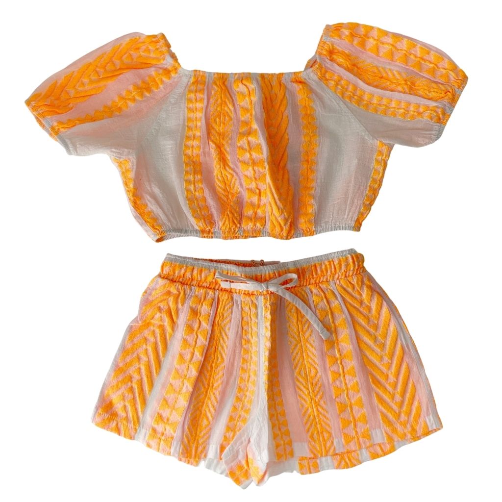 The Kelly shorts and Iria blouse top in neon orange from the children's line of Greek brand, Devotion Twins