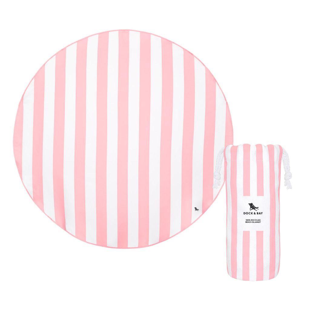 Product shot of Dock and Bay cabana round beach towel in Malibu pink with pouch