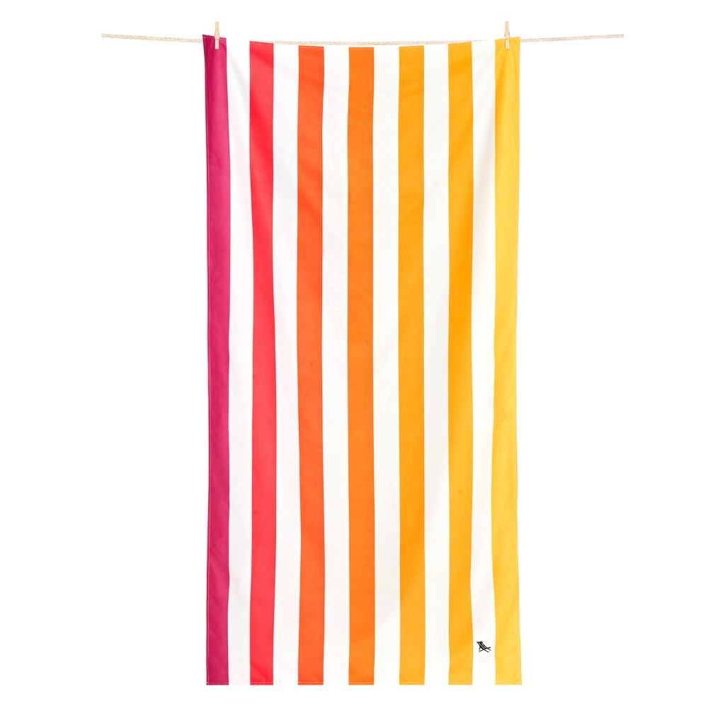 Product shot of hanging Dock and Bay Striped Summer Beach towel in Peach Sunrise