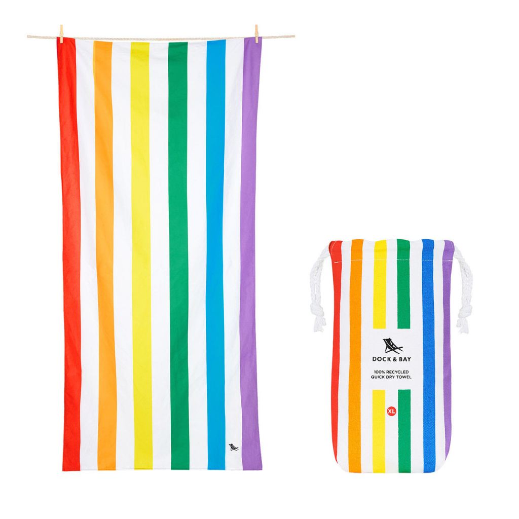 Product shot of Dock and Bay Striped Summer Beach towel and pouch in Rainbow Skies