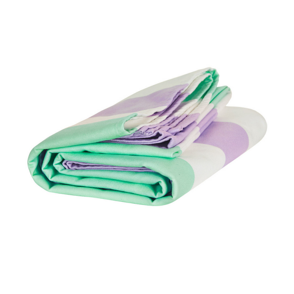 Folded Dock & Bay fast-drying summer beach towel in Lavender Fields featuring lilac purple and mint green stripes